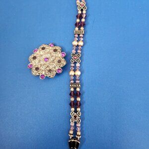 purple bracelet and pin